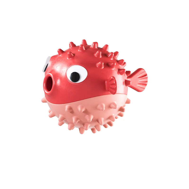 Green fish-shaped interactive dog toy with textured surface for treat dispensing and dental cleaning