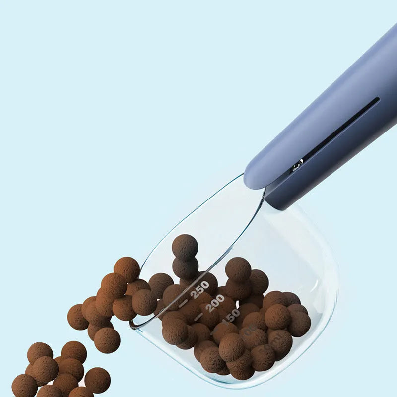 Transparent plastic pet food spoon with scale markings for measuring cat and dog dry food, available in Blue Pink White