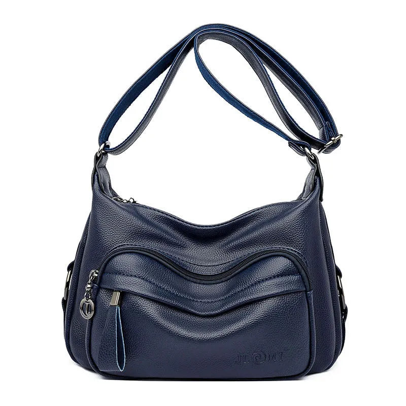 Blue women's large shoulder bag with crossbody strap showing internal mobile phone and certificate pockets