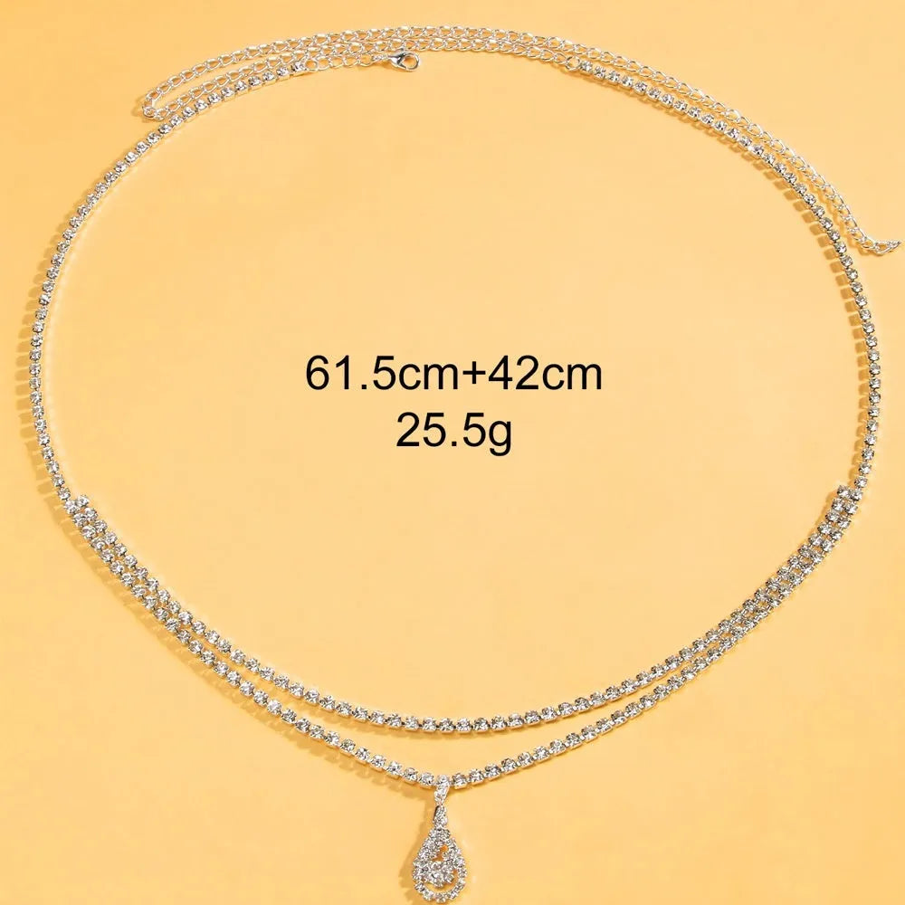 Gold or silver waist chain with water drop pendant and tassel detail, showing lobster clasp closure.