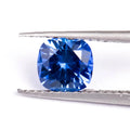 Royal blue loose gemstone in heart shape on a white background for jewellery making.