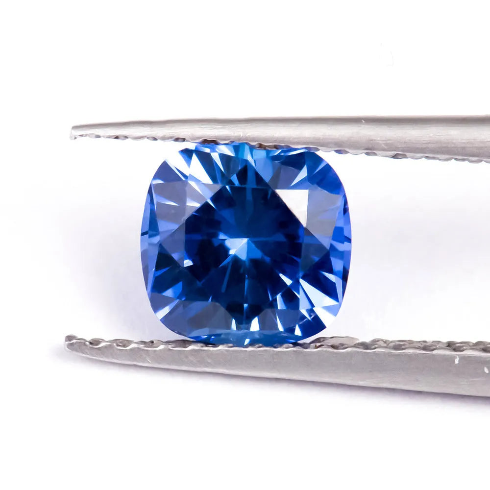 Royal blue loose gemstone in heart shape on a white background for jewellery making.