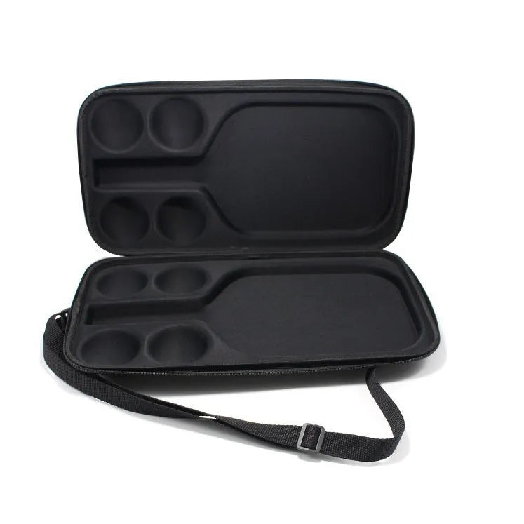Black pickleball shoulder storage bag with double straps showing one paddle and four balls inside.
