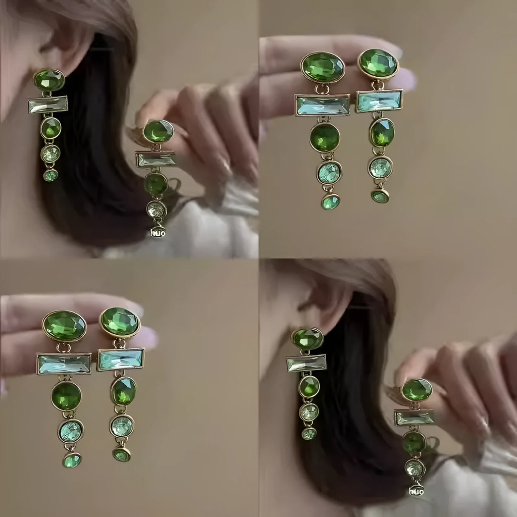 A pair of retro green gradient alloy earrings with geometric shapes and a long tassel design.