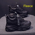 Women's black mesh platform shoes with a hollow-out design and a velvet lining on display.