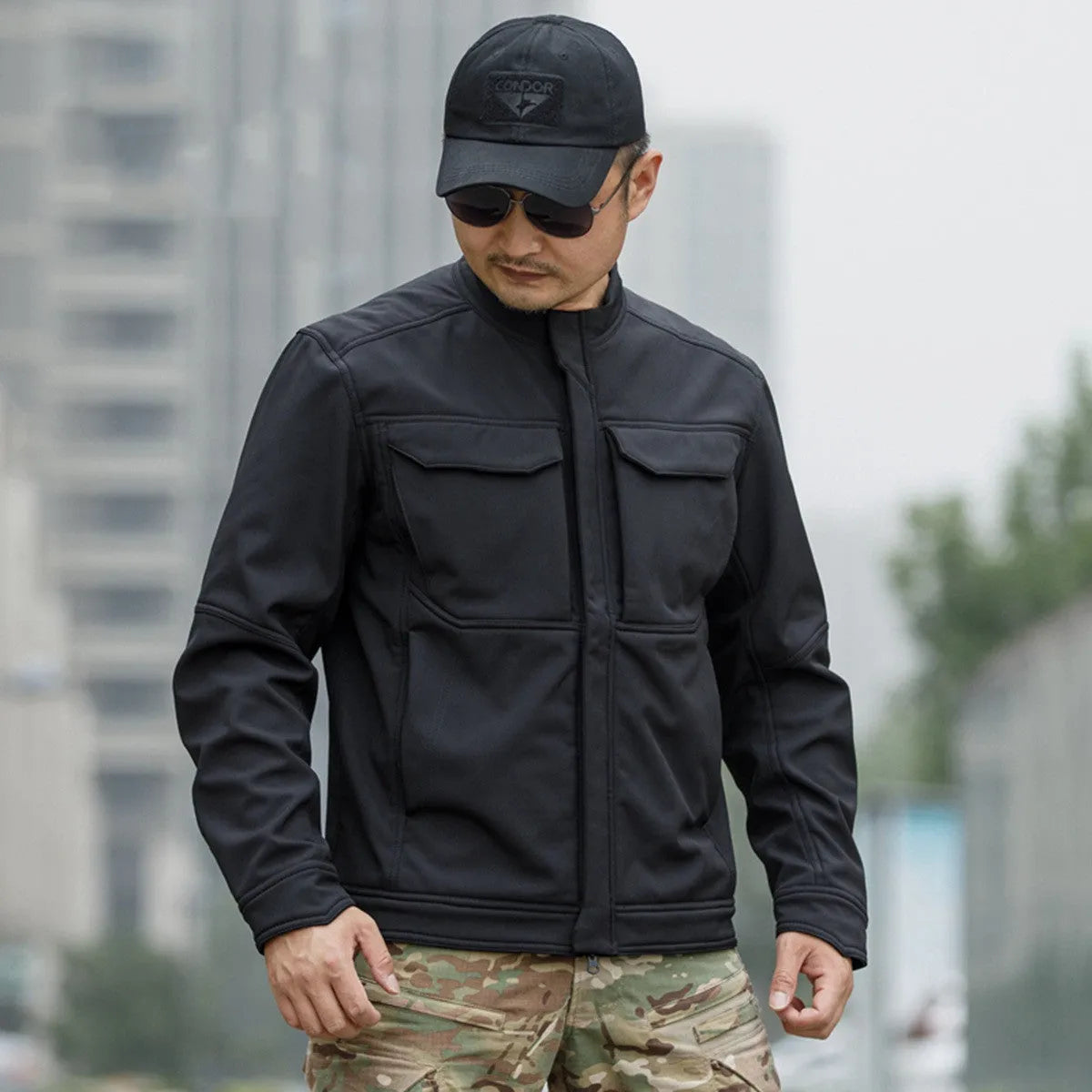 Black soft shell tactical jacket for mountaineering and camping, showing cardigan style and windproof design.