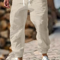Men's cotton linen trousers with elastic waist in straight leg fit, shown in Army Green colour