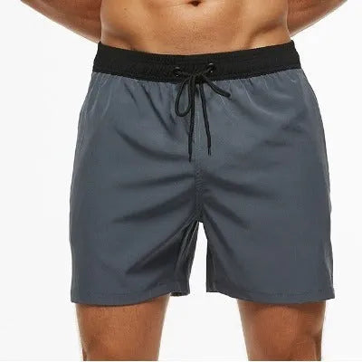 Men's blue running shorts with a drawstring waist and a zippered side pocket.