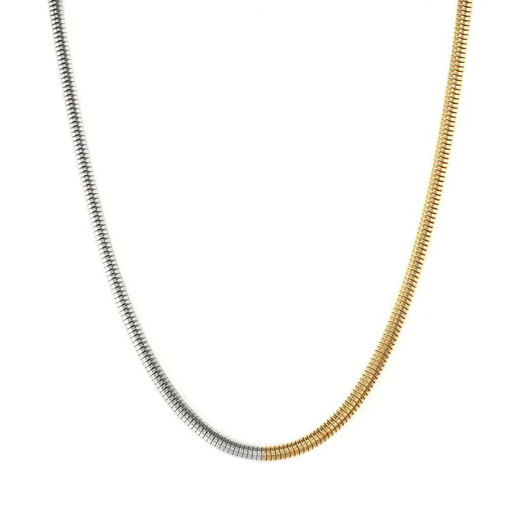 Gold-coloured stainless steel snake bone chain necklace with geometric shapes for women.