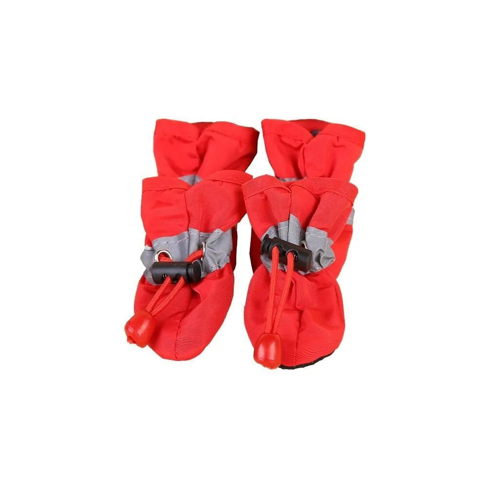 Multicolour set of four breathable cloth dog shoes with non-slip soft bottom on a white background