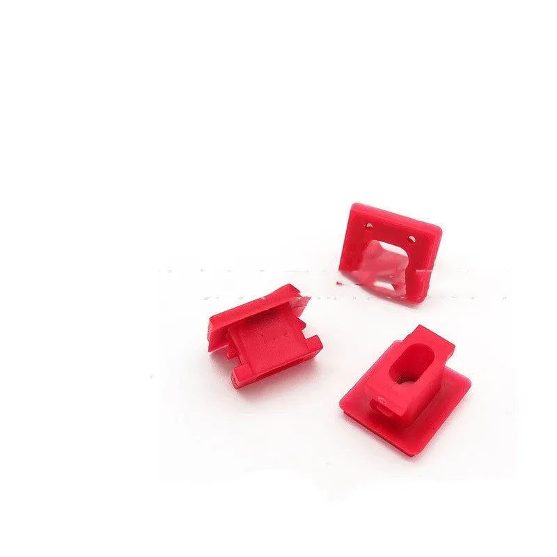 Ten black plastic BMW interior door panel trim clips or fasteners on a white background.