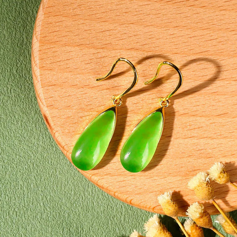 A pair of retro-style geometric water droplet earrings in jade green, made from electroplated copper.