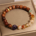 Women's crystal bracelet in yellow tower crystal, ebony, amethyst with pearl and sequin accents