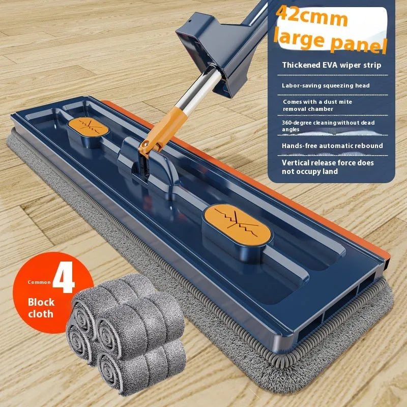 Large flat mop with long stainless steel handle and blue rotating mop head on a wooden floor.