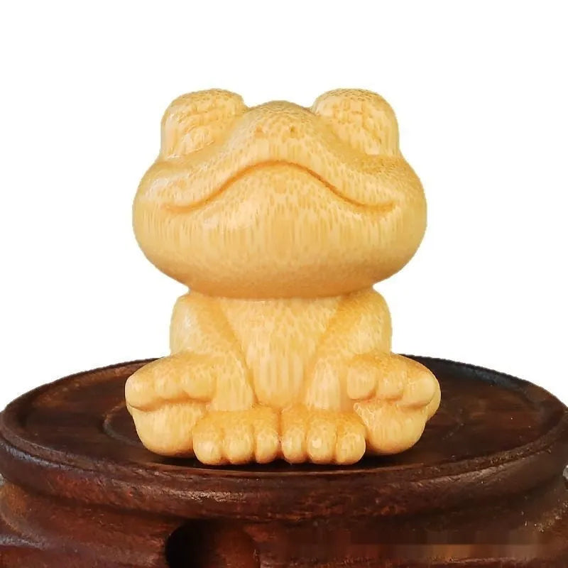 Solid bamboo smiling frog carving ornament measuring 5cm height with cartoon design