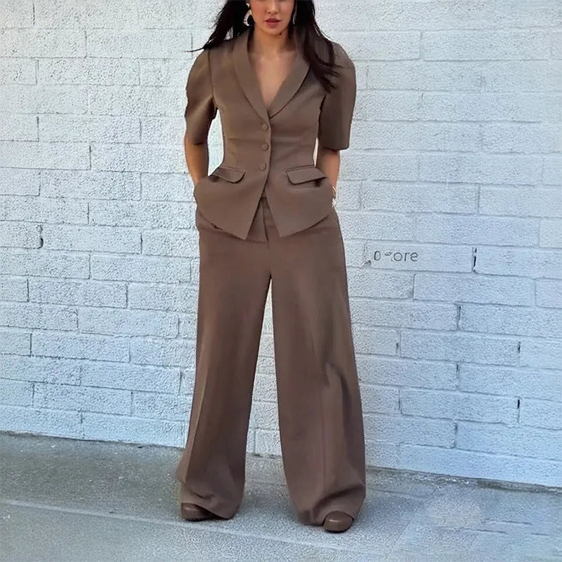 Brown men's slim fit two-piece polyester suit with long sleeves and regular trousers on a hanger.