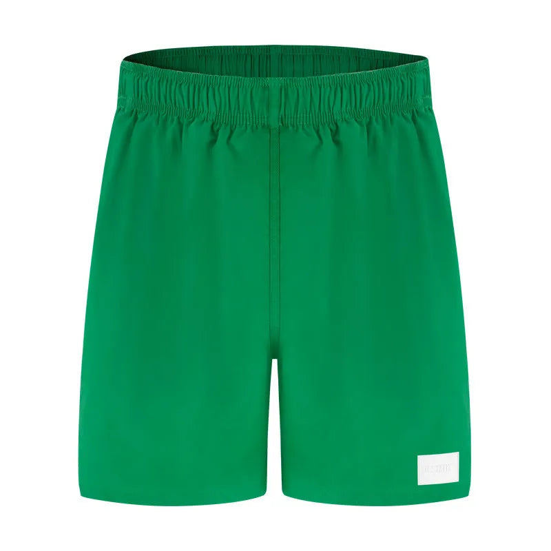 Men's quick-drying nylon beach shorts in blue with straight leg openings.
