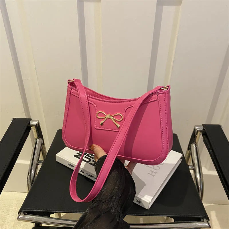 Portable shoulder western style bagg bag in PU with bow accent, available in six colours, 24x14x5 cm