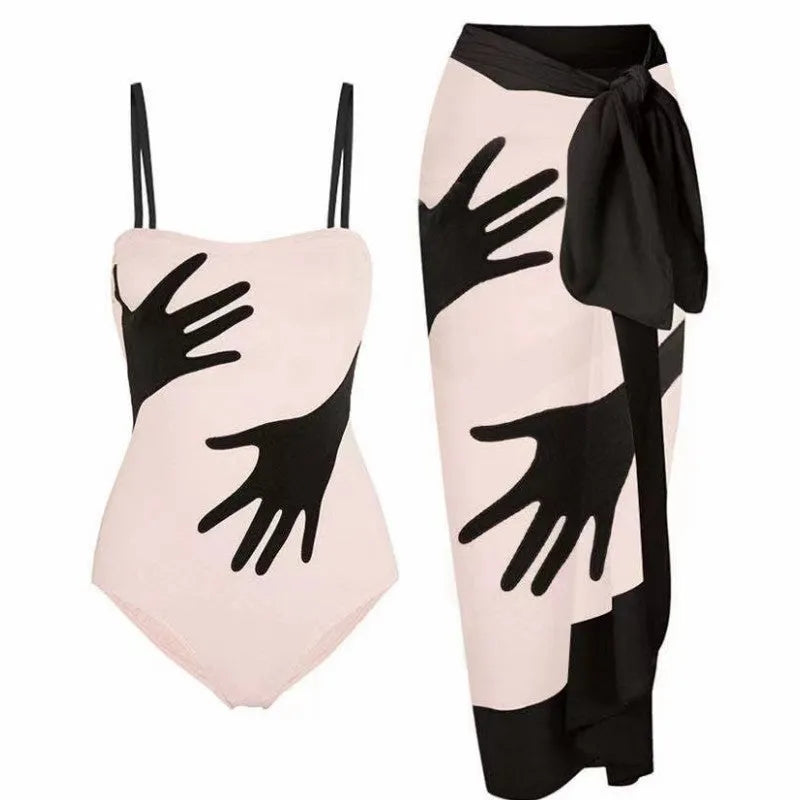 Women's one-piece bikini swimsuit with a gauze skirt overlay.