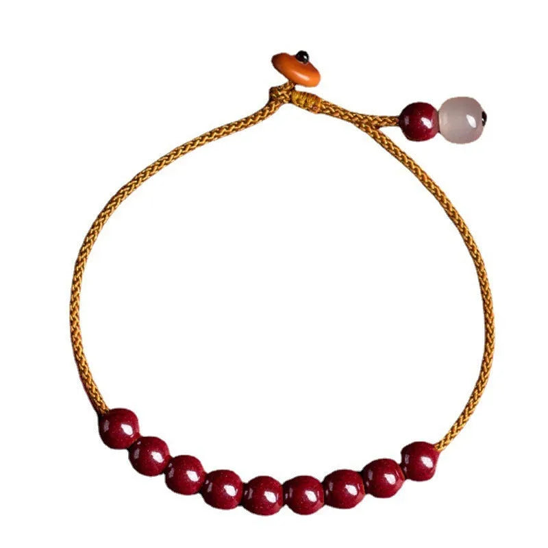 Hand-woven natural cinnabar bracelet with simple geometry shape on light background