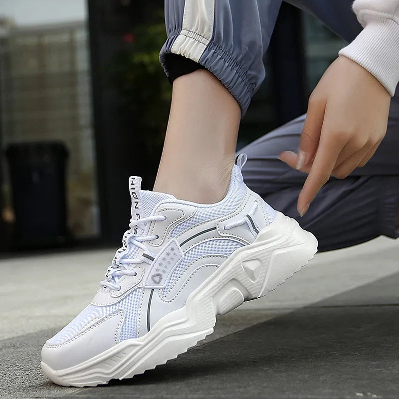 Women's white and black casual mesh sports shoes with a thick PU sole and buckle.