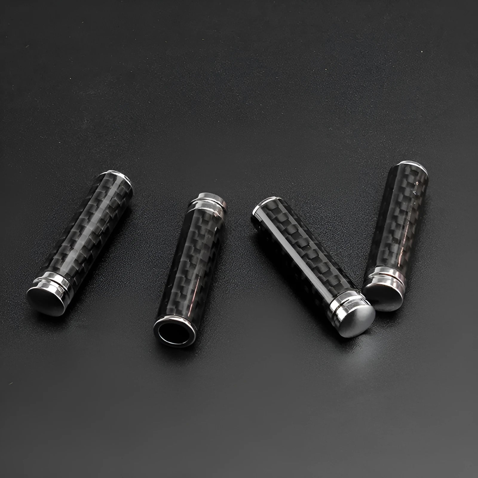 Set of four carbon fibre and metal car door handle decorative replacement covers.