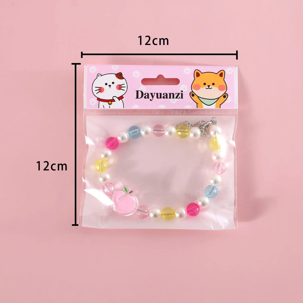 Colourful bead pet necklace for dogs and cats in rainbow, peach, or small flower patterns with adjustable sizing