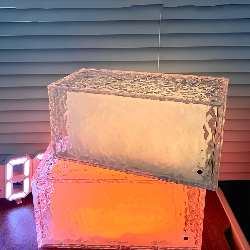 Clear acrylic geometric ice cube shaped small night light with internal LED glow.