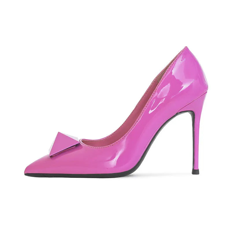 Pink patent leather women's stiletto heels with pointed toes and rivet buckle detailing