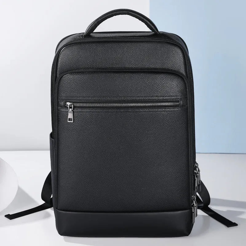 Black genuine leather men's business laptop backpack with curved shoulder straps.