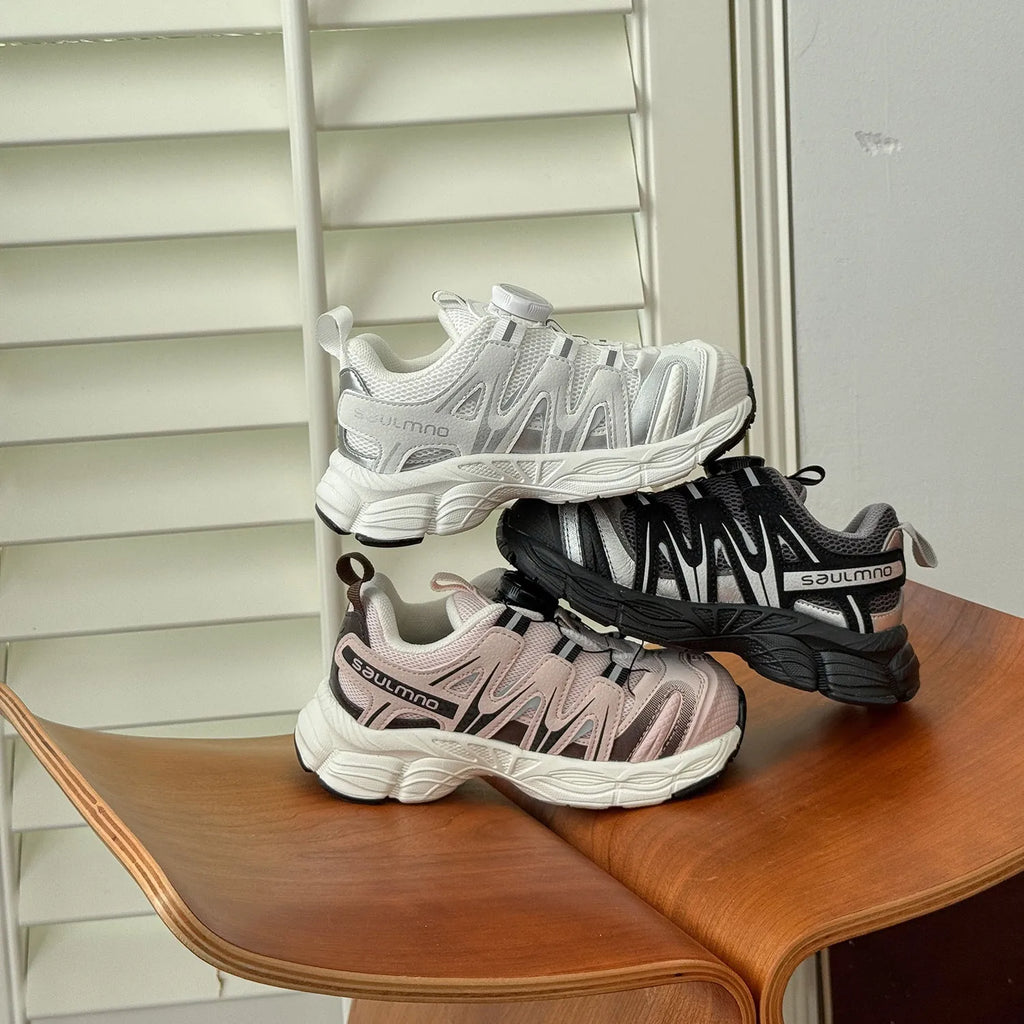 Kids' casual shoes in black, beige, or pink with a lightweight PU leather mesh upper.