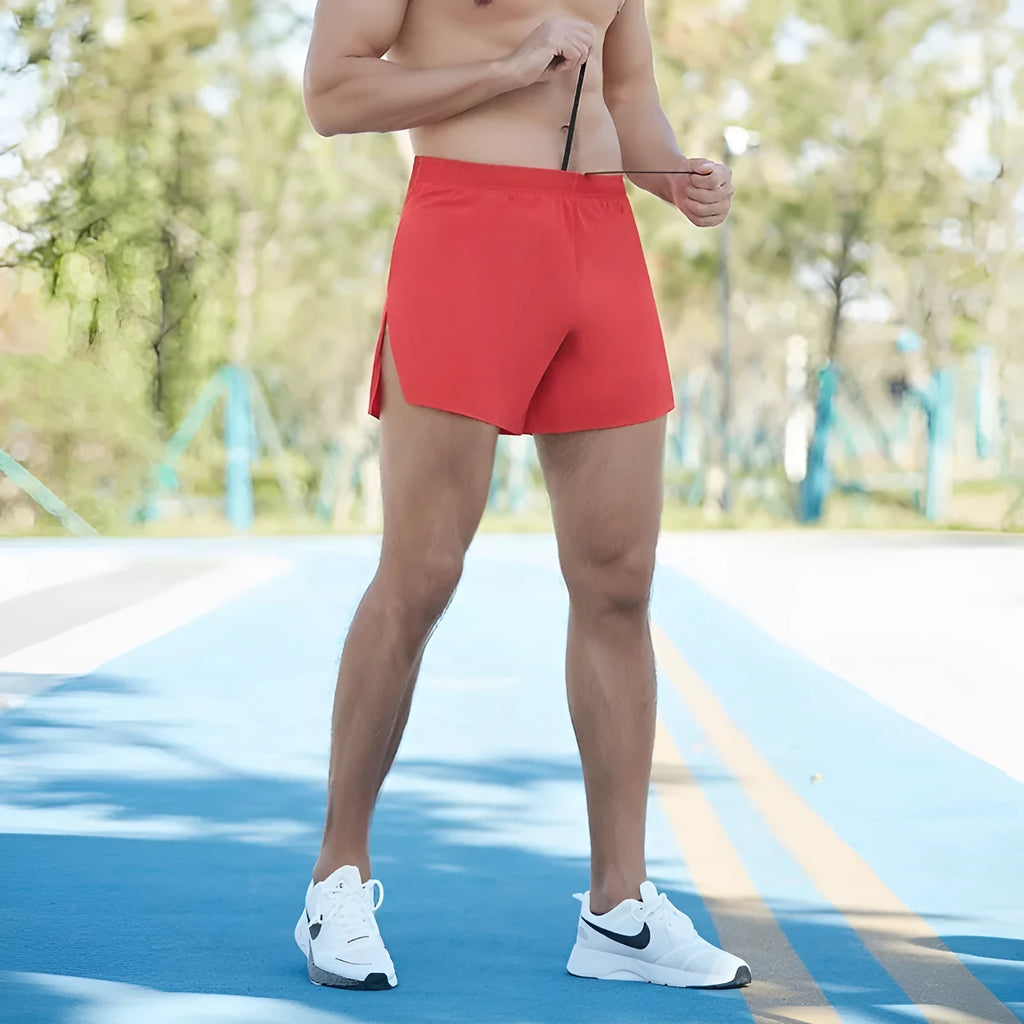 Men's high-waist loose fit off-road running shorts in quick-dry fabric, shown in red, black, navy and grey.