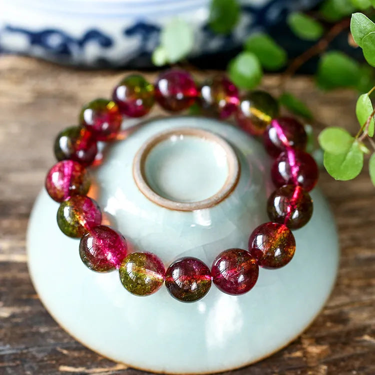 Women's watermelon crystal bracelet showing pastoral design elements on wrist, available in 6mm, 8mm, 10mm, and 12mm sizes.