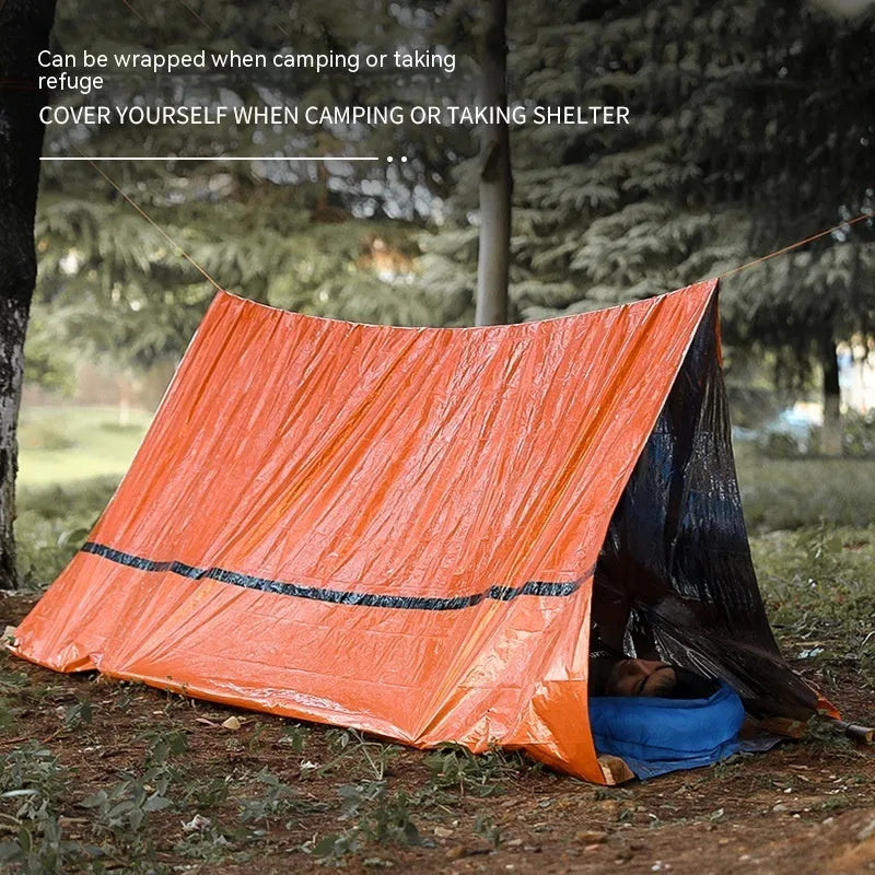 Orange disaster relief tent with sleeping bag and raincoat emergency shelter kit
