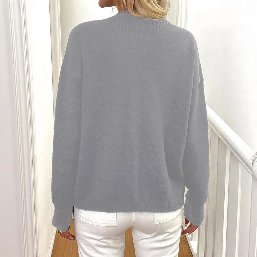 Women's grey deer plush sweater coat with long princess sleeves on a hanger.