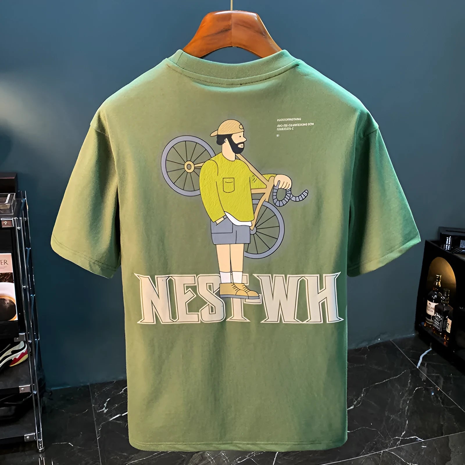 Green men's loose fit T-shirt with a Literary Youth graphic print on the front.
