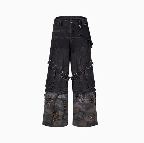 Men's grey cotton jeans with camouflage pattern splicing and decorative pin and ribbon details on the legs.