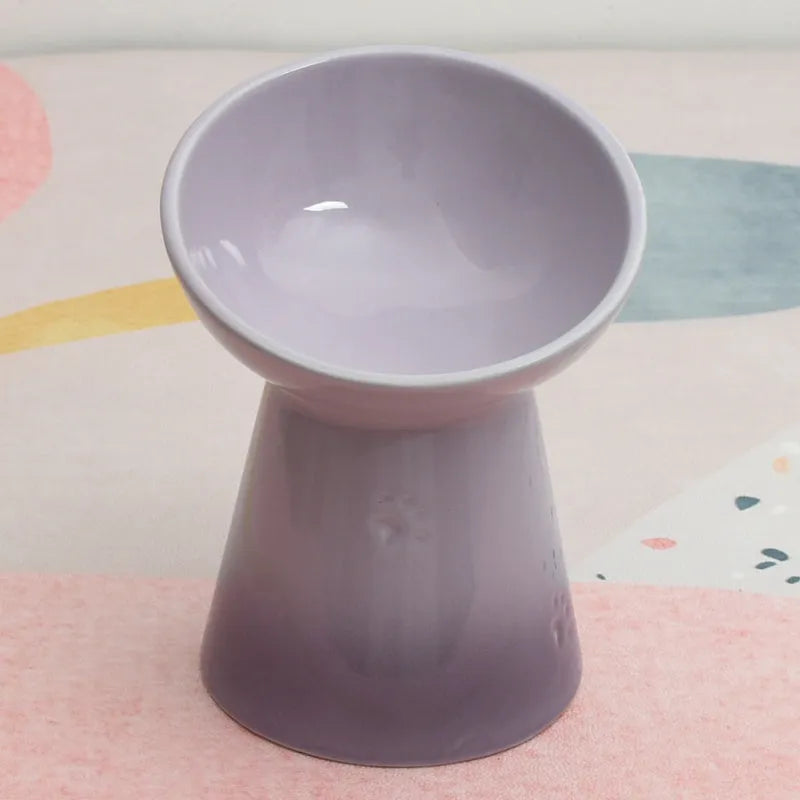 Ceramic anti-tumble pet bowl for dogs and cats with high foot and neck protector.