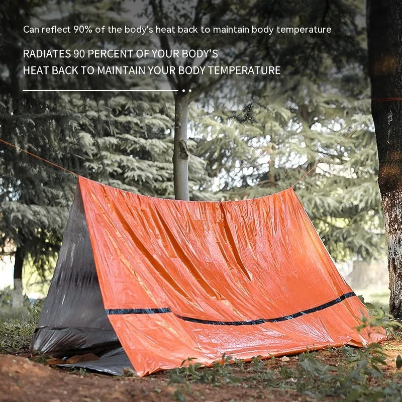 Orange disaster relief tent with sleeping bag and raincoat emergency shelter kit