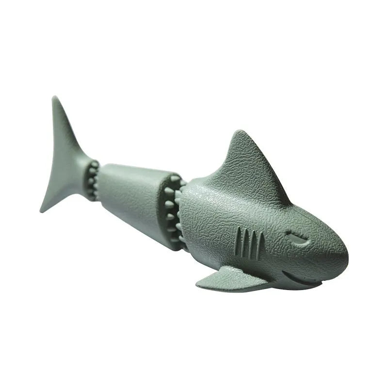 Blue and green rubber dog chew toy shaped like a deep sea shark, conch, and starfish.