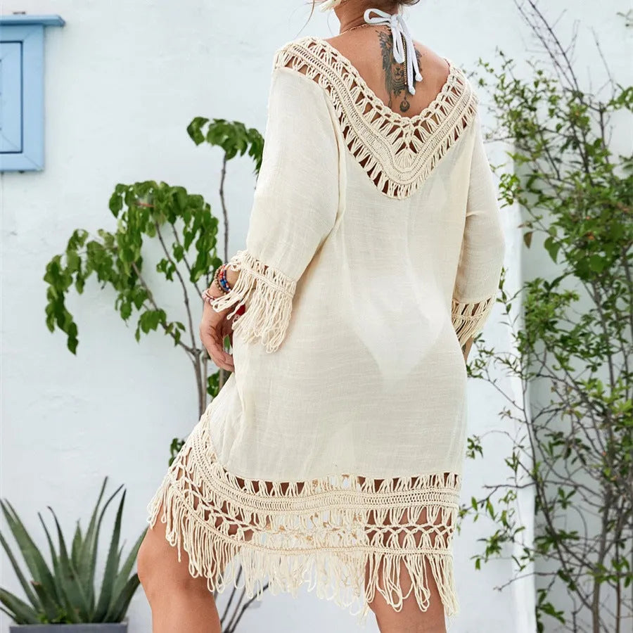 Apricot crocheted patchwork beach dress with mid-length skirt and half sleeves on hanger