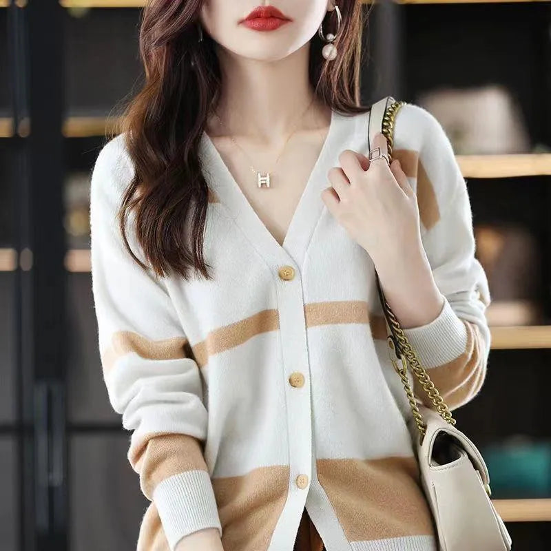 Women's slim-fit V-neck cardigan with 3D striped pattern and button front in assorted colours.