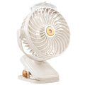 White portable USB rechargeable clip fan with spray mist, brushless motor, and 5 speed modes on a desk