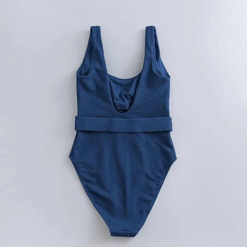Navy blue women's one-piece slimming swimsuit with triangle design and chest pad support