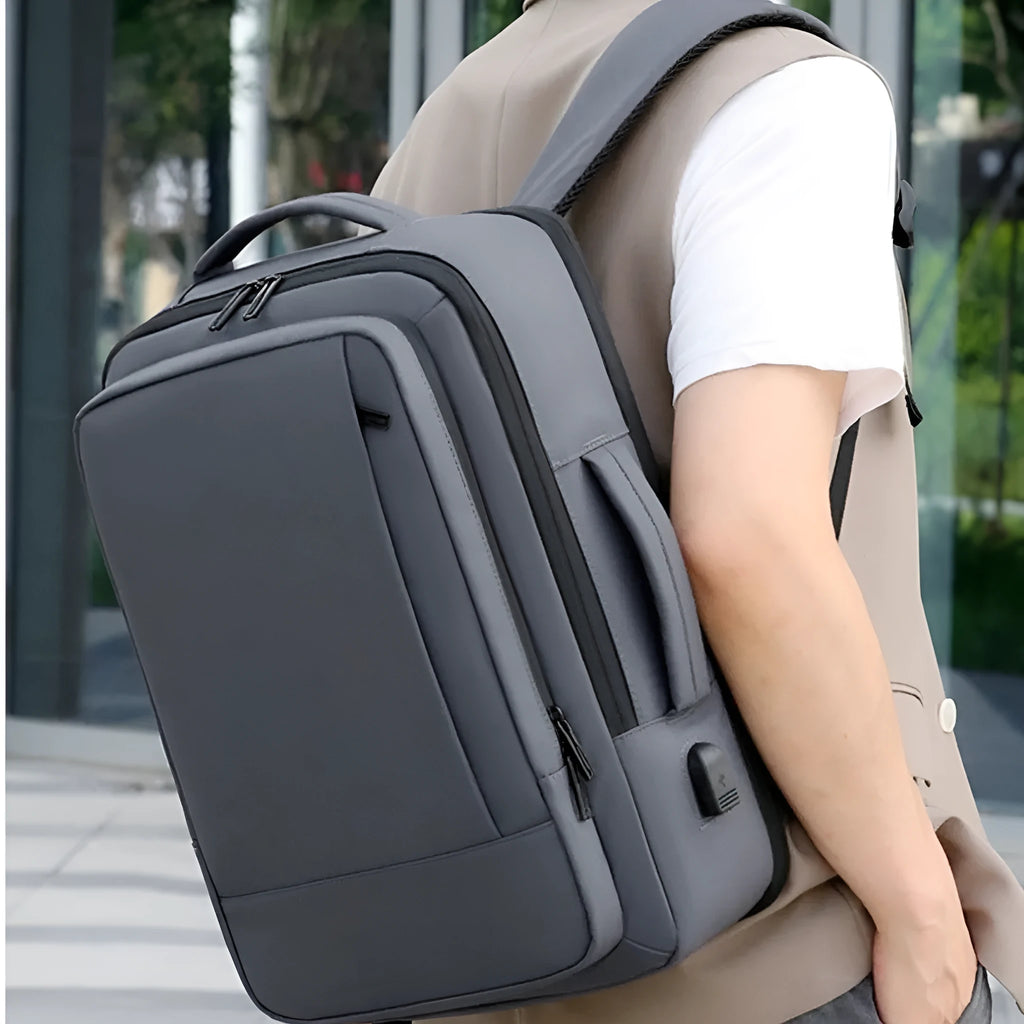 Black or grey waterproof Oxford cloth business travel backpack with curved shoulder strap and hand-carrying functionality