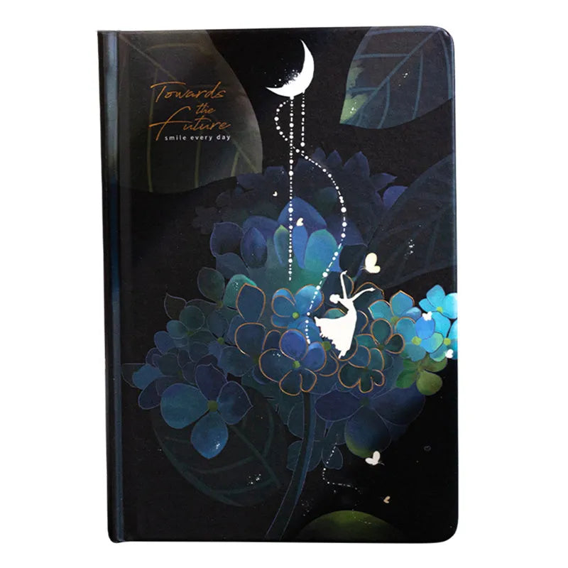 A5 notebook with luminous cover open to show pages with colour illustrations