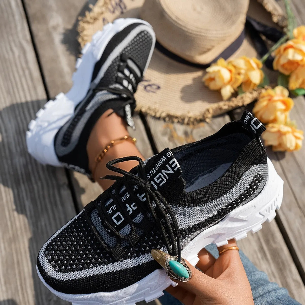 Women's Flyknit mesh lace-up sneakers in multiple colours on a white background.