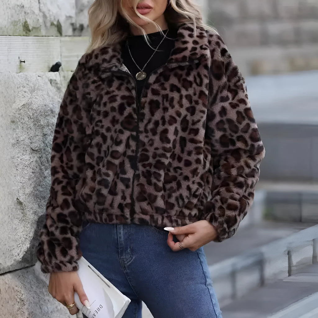 Women's loose leopard print plush coat with front zipper and raglan sleeves on a hanger.