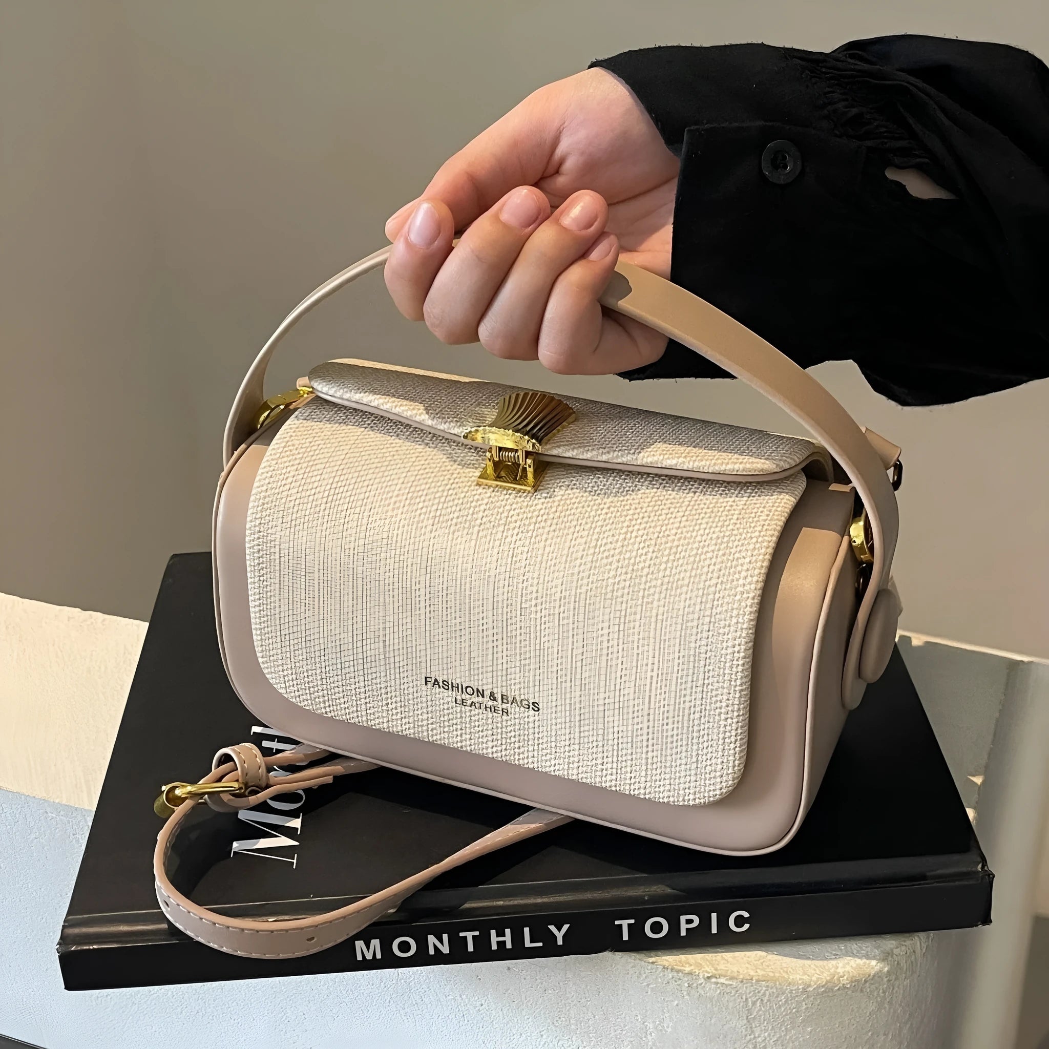 Women's PU messenger bag with lock and contrast stitching in rose pink colour, horizontal square shape