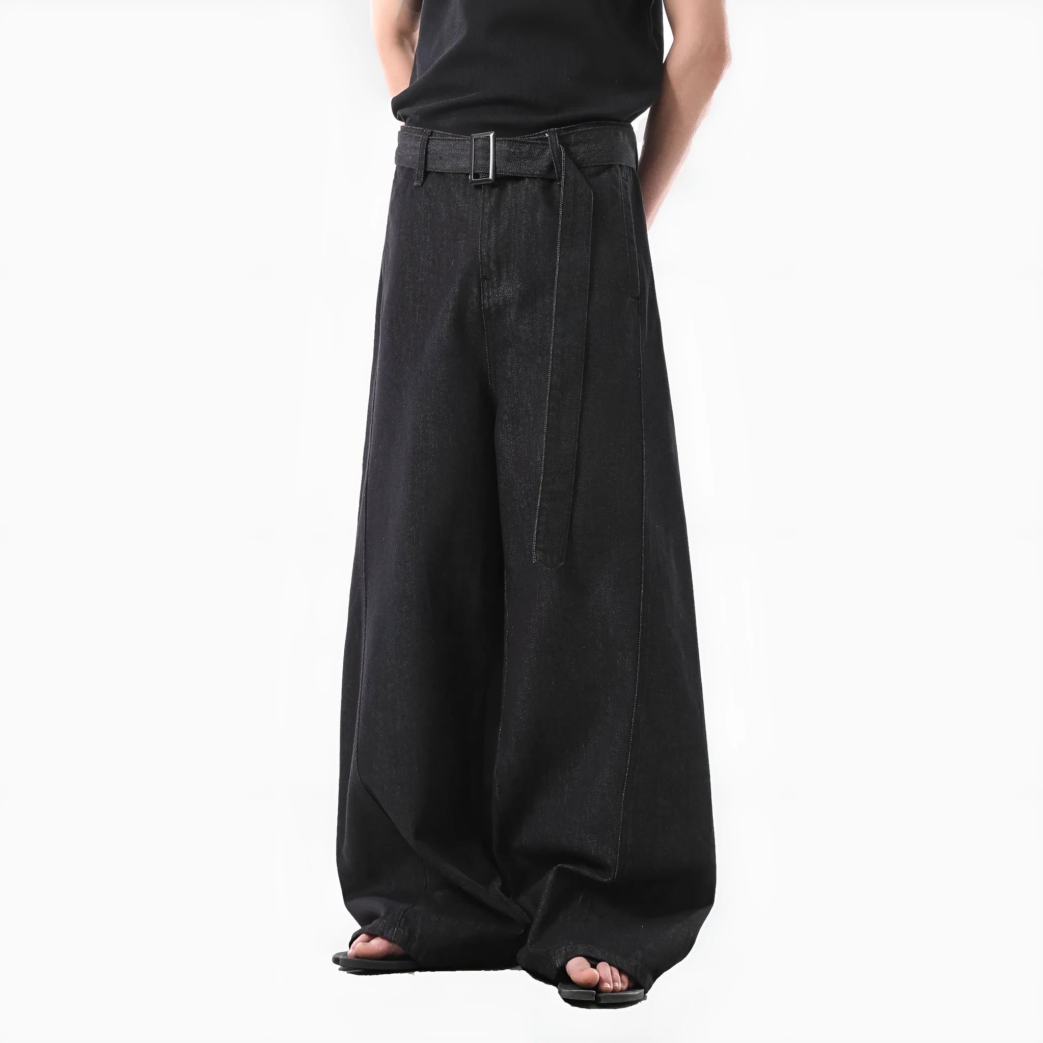 Black high-waist straight-leg jeans with a retro gold wash detail on a mannequin.